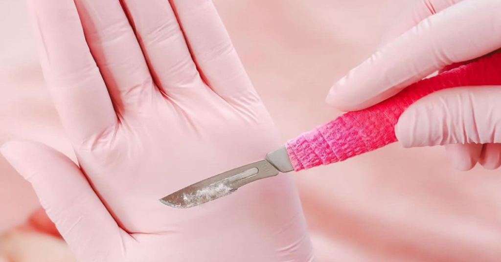 pink dermaplaning knife