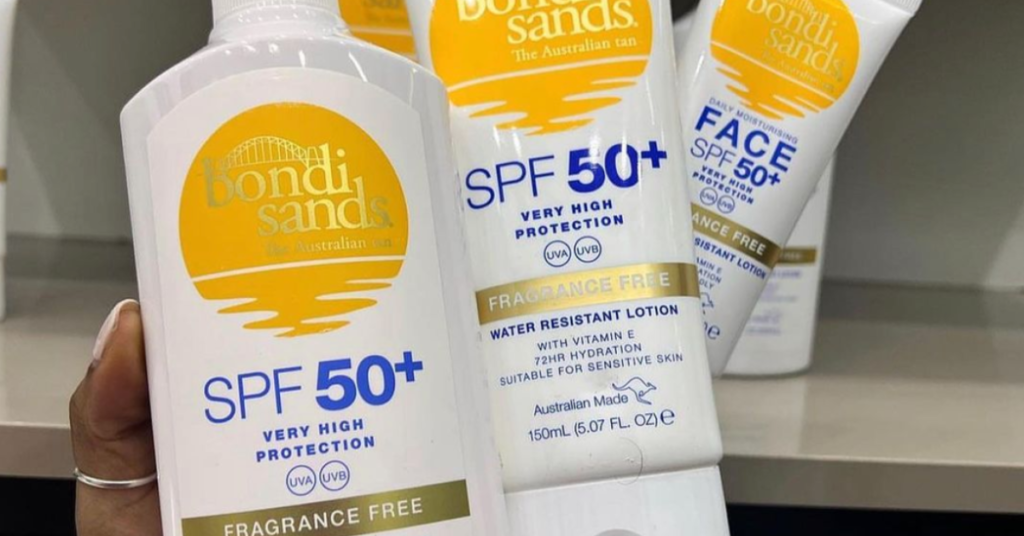 three white sunscreen bottles spf 50