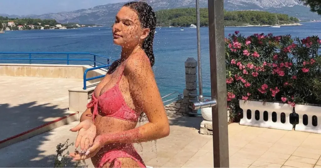 young woman showering outside