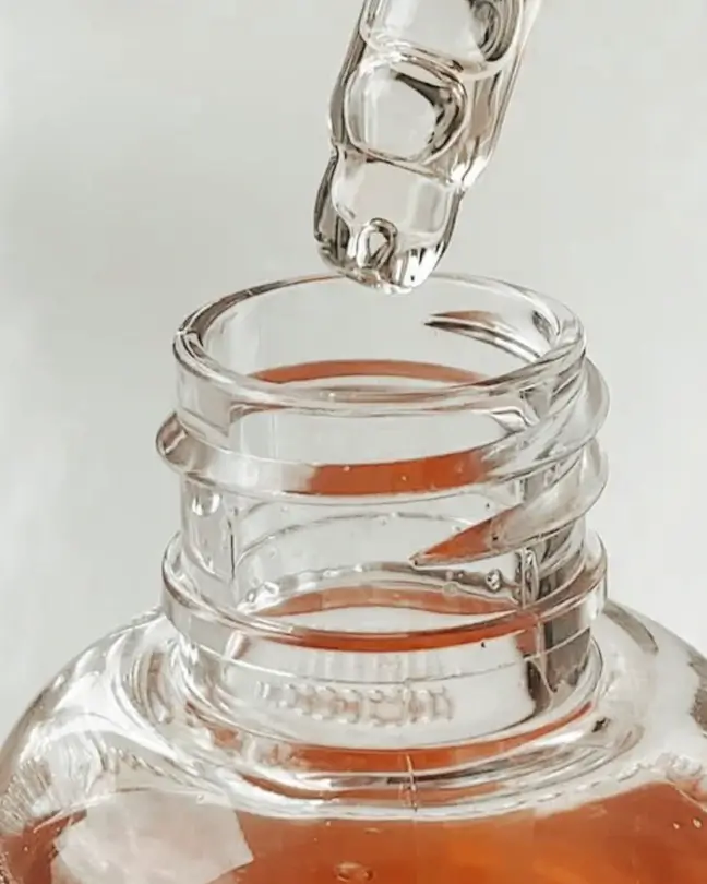 Skincare serum in glass bottle
