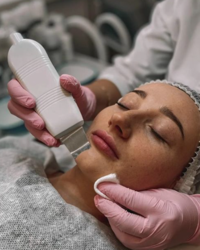 young wman getting professional dermaplaning treatment