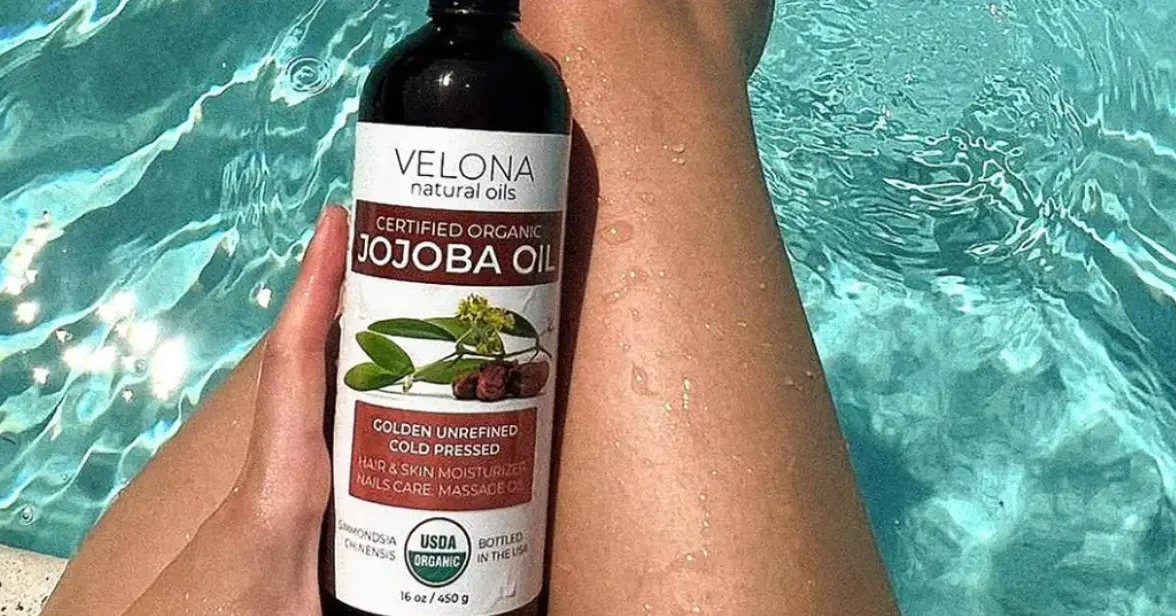 jojoba oil bottle on pool