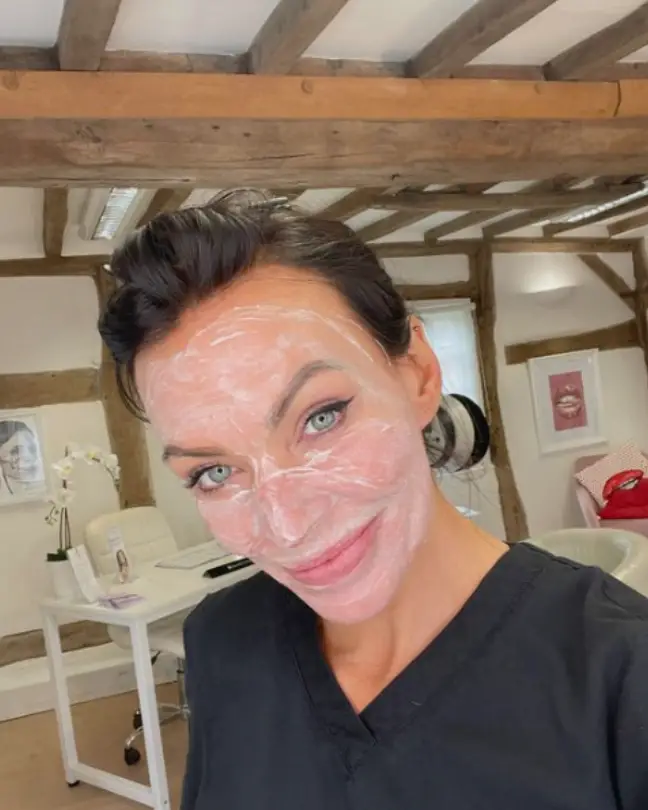 woman with skincare cream in her face