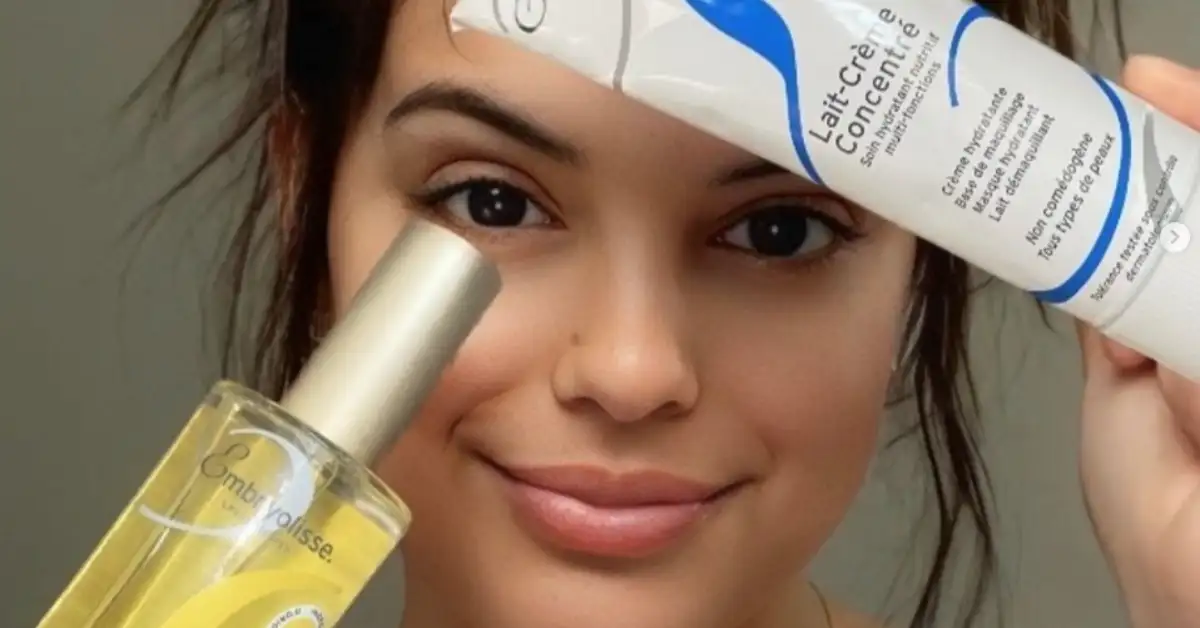 Young brunette woman with french skincare products