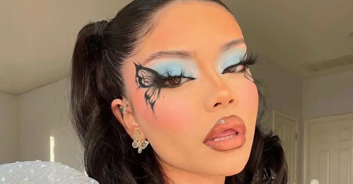 young woman with butterfly makeup