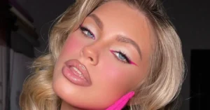 young blonde woman with barbie makeup